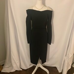 Roland Mouret Black cocktail dress with a
white collar.